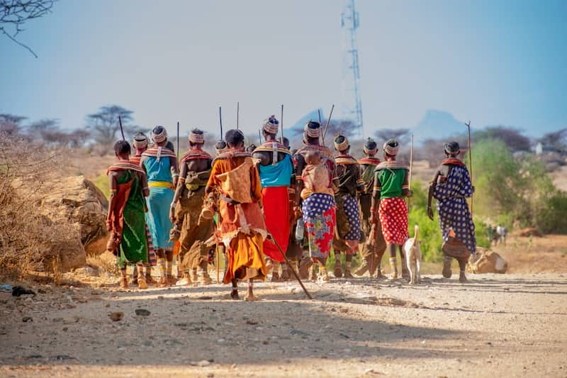 pastoralist community walking together in traditional dress Teso Elites Development Association - Teso Elites Development Association