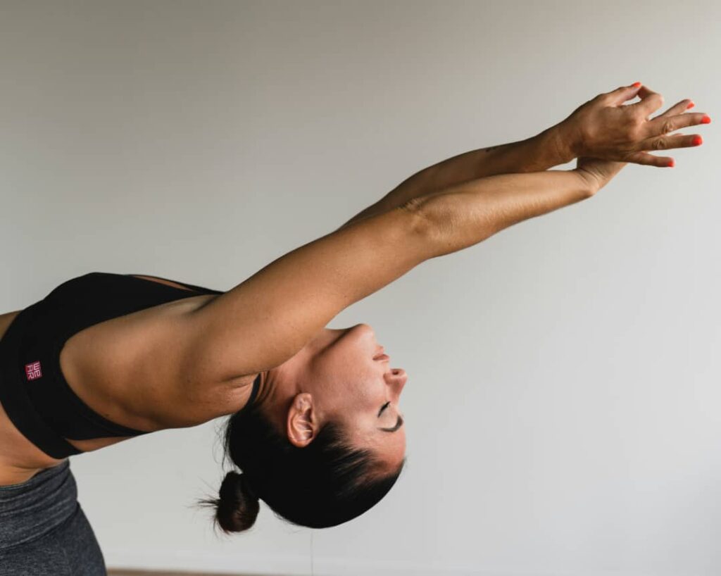 woman stretching in a yoga backbend Teso Elites Development Association - Teso Elites Development Association