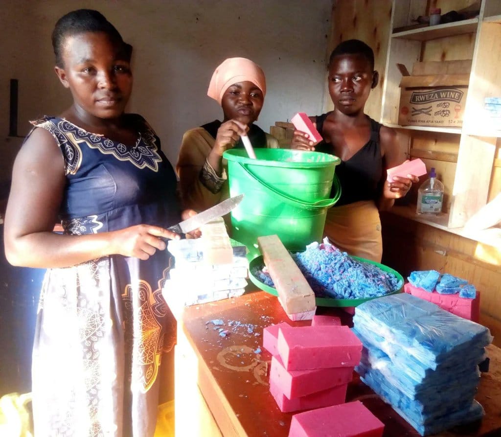 young women making bar soap in a workshop teda - Teso Elites Development Association
