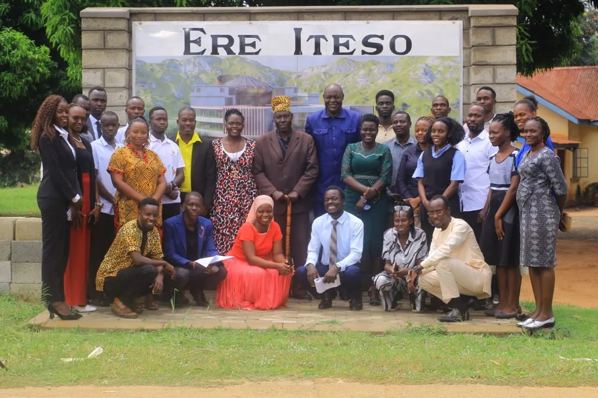 Members in TEDA branded shirts at a community gathering